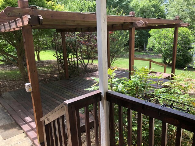 104 Wesley Ln, Eatonton, GA 31024 - wooden terrace featuring a lawn