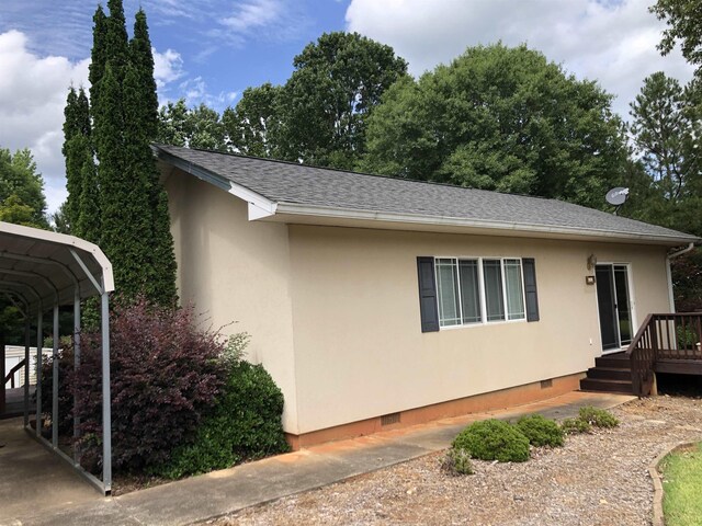 104 Wesley Ln, Eatonton, GA 31024 - view of home's exterior featuring crawl space and stucco siding