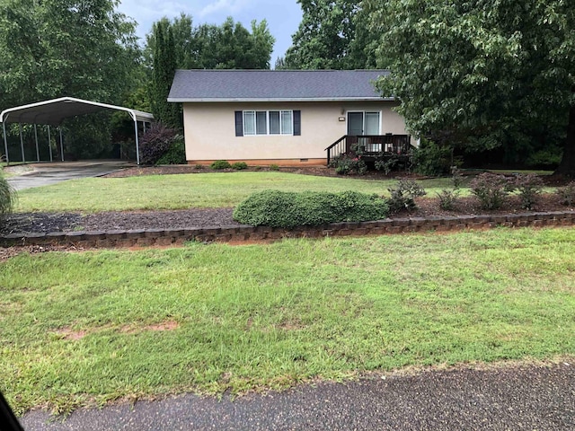 104 Wesley Ln, Eatonton, GA 31024 - view of front facade with a detached carport, stucco siding, a front lawn, concrete driveway, and a wooden deck