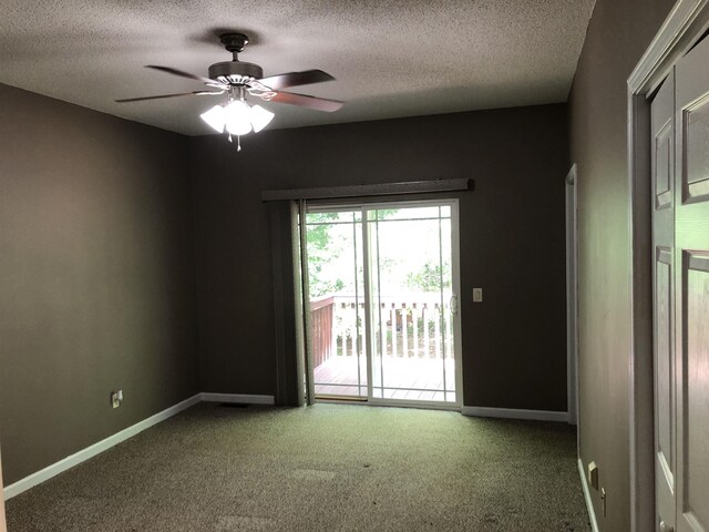 104 Wesley Ln, Eatonton, GA 31024 - carpeted spare room featuring a textured ceiling, ceiling fan, and baseboards