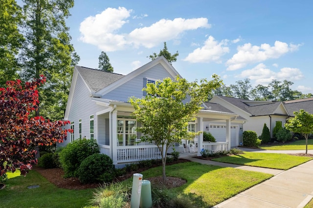 746 Markhams Dr, Madison, GA 30650 - view of front of property with a garage, roof with shingles, a front yard, a porch, and driveway
