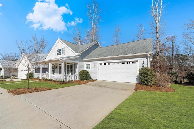view of front of property with a porch, a garage, a front yard, and concrete driveway