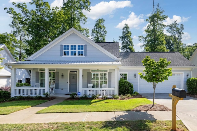 746 Markhams Dr, Madison, GA 30650 - view of front of home featuring covered porch, a front yard, a garage, and driveway