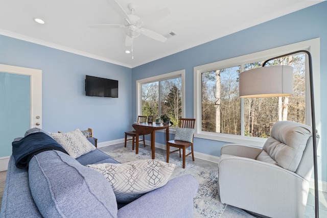 living room with crown molding, baseboards, recessed lighting, and ceiling fan