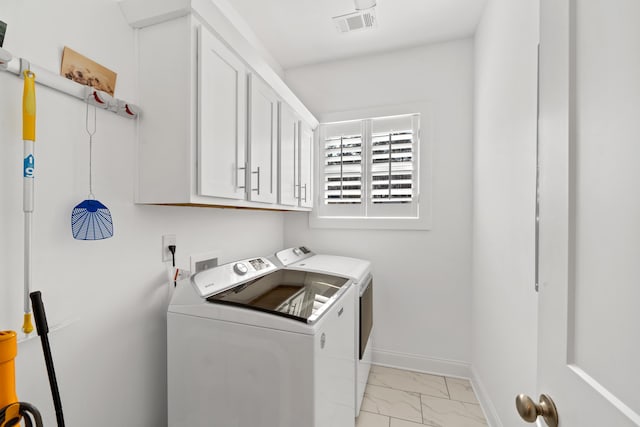 746 Markhams Dr, Madison, GA 30650 - laundry room with independent washer and dryer, baseboards, marble finish floor, visible vents, and cabinet space