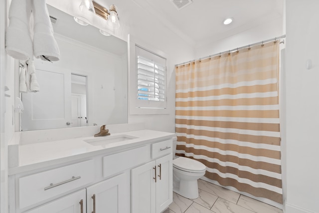bathroom with toilet, vanity, marble finish floor, and visible vents