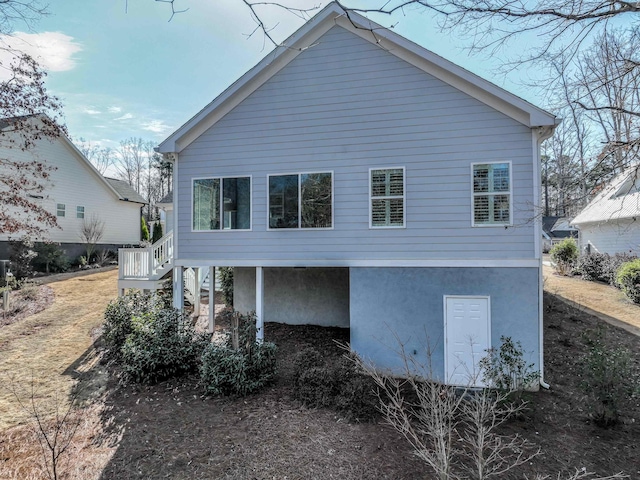 view of side of home with stairway