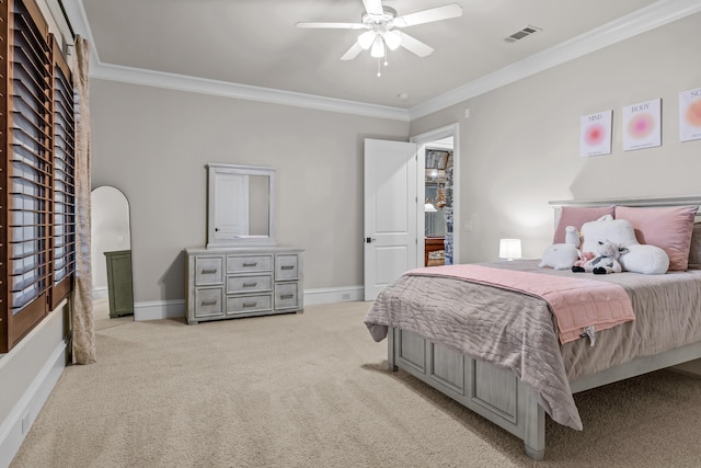 bedroom featuring ornamental molding, light colored carpet, and ceiling fan