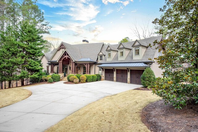 view of front of house with a garage and a front lawn