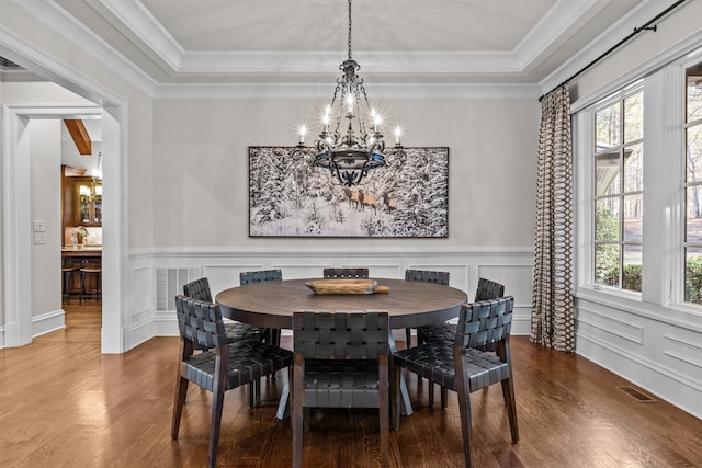 1030 Ridge Grove Ct, Greensboro, GA 30642 - dining room with a raised ceiling, an inviting chandelier, and wood finished floors