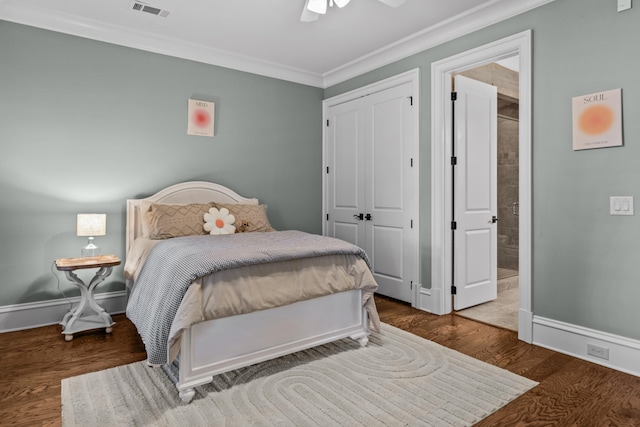 bedroom featuring ceiling fan, hardwood / wood-style floors, ensuite bathroom, ornamental molding, and a closet