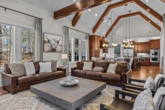 1030 Ridge Grove Ct, Greensboro, GA 30642 - living area with light wood finished floors, a notable chandelier, plenty of natural light, and beam ceiling