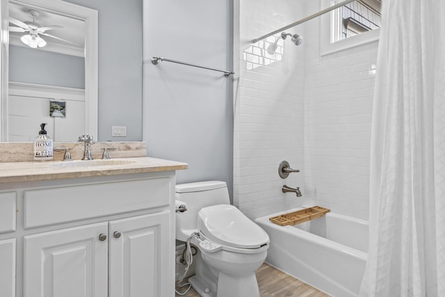 full bathroom featuring shower / bath combo, wood-type flooring, vanity, and toilet