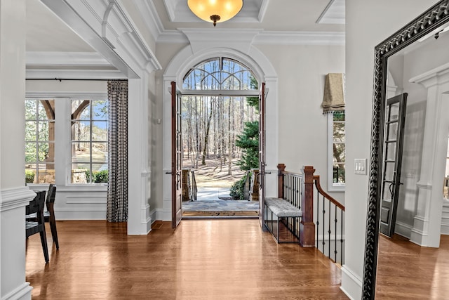 foyer featuring crown molding and wood-type flooring