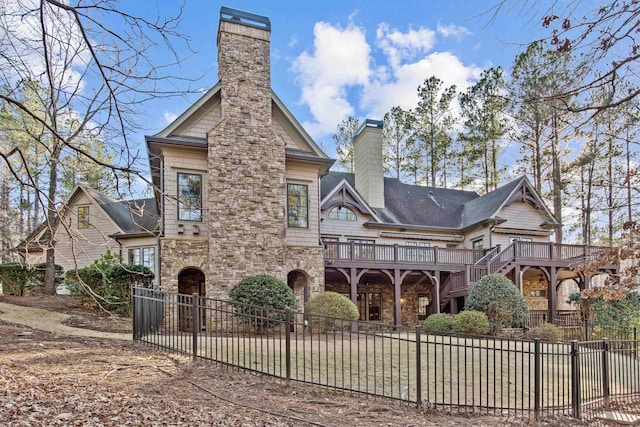 rear view of house featuring a deck