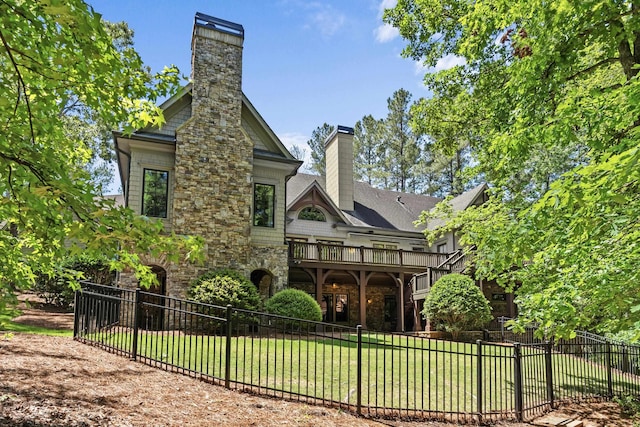 1030 Ridge Grove Ct, Greensboro, GA 30642 - rear view of property with stone siding, a chimney, a lawn, and fence private yard