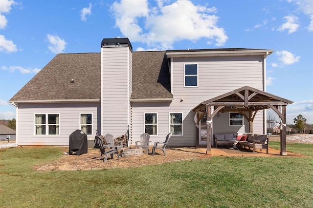 back of house with a gazebo, a patio area, a lawn, and an outdoor living space with a fire pit