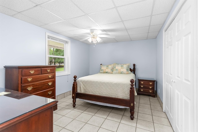 1060 Old Rock Rd, Greensboro, GA 30642 - bedroom with a closet, a drop ceiling, light tile patterned floors, and ceiling fan