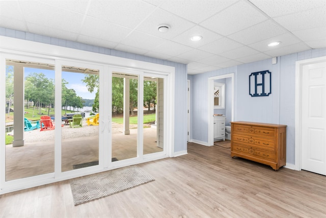 1060 Old Rock Rd, Greensboro, GA 30642 - doorway to outside with light wood finished floors, baseboards, a paneled ceiling, and recessed lighting