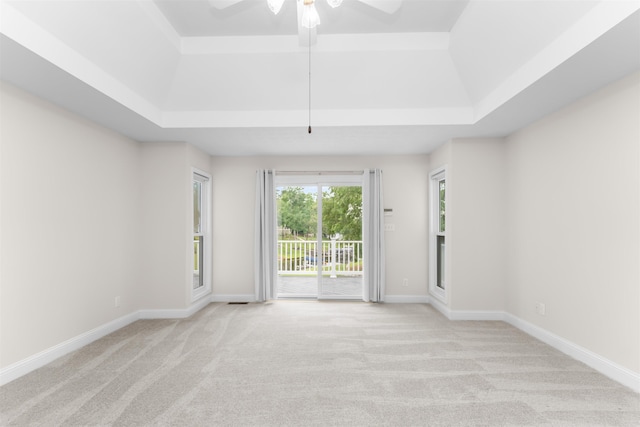 1060 Old Rock Rd, Greensboro, GA 30642 - empty room with a raised ceiling, carpet, a ceiling fan, and baseboards