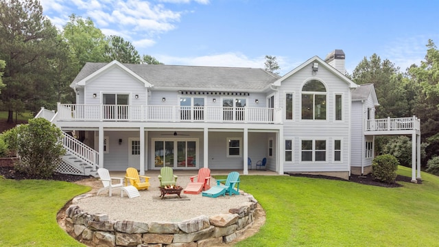 1060 Old Rock Rd, Greensboro, GA 30642 - rear view of property with a fire pit, a ceiling fan, a chimney, and a lawn