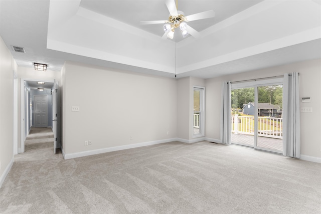 1060 Old Rock Rd, Greensboro, GA 30642 - unfurnished room featuring light carpet, a raised ceiling, baseboards, and a ceiling fan
