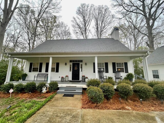 106 Hoot Owl Ln, Eatonton, GA 31024 - bungalow with a chimney and covered porch