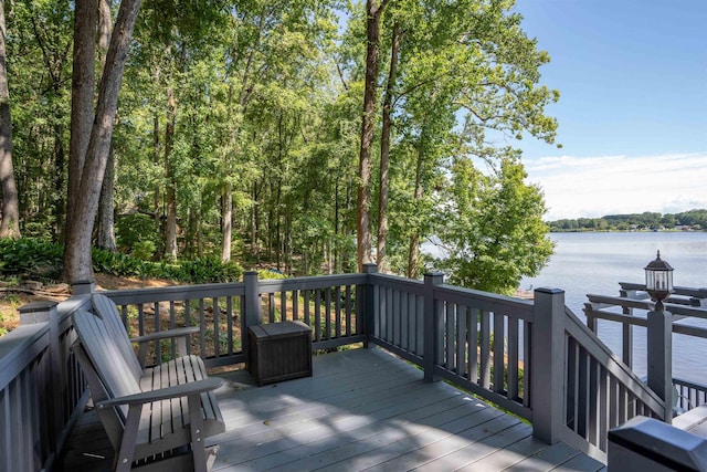 wooden deck featuring a water view