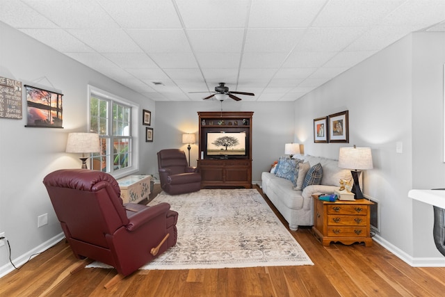 106 Hoot Owl Ln, Eatonton, GA 31024 - living room featuring ceiling fan, wood finished floors, baseboards, and a paneled ceiling