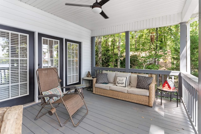 sunroom with ceiling fan and outdoor lounge area
