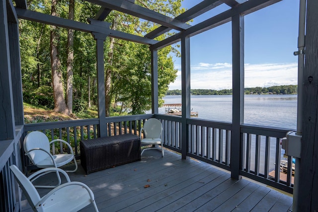sunroom / solarium featuring a water view and plenty of natural light
