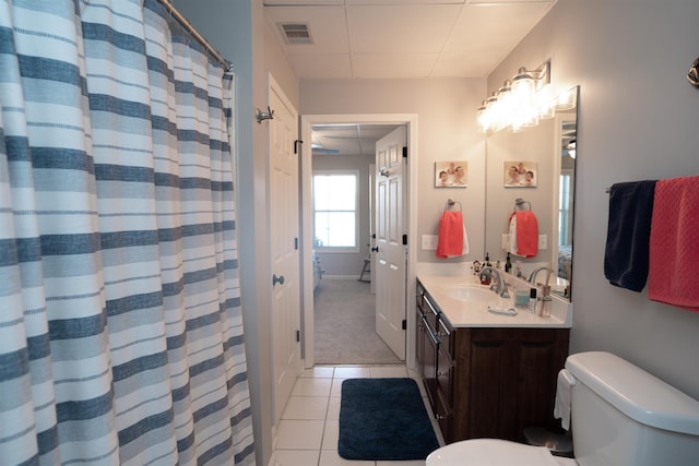 full bath with toilet, vanity, tile patterned floors, a paneled ceiling, and a shower with shower curtain