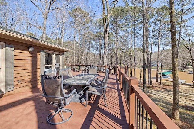 wooden deck featuring outdoor dining space
