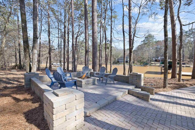 view of patio / terrace with a fire pit