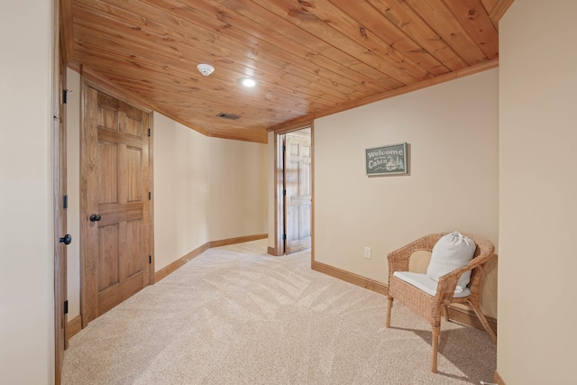 living area featuring crown molding, wooden ceiling, carpet flooring, and baseboards
