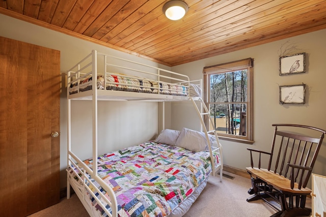 bedroom with carpet, wooden ceiling, and visible vents