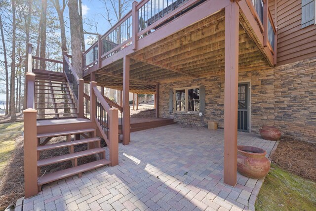 view of patio featuring stairway and a wooden deck