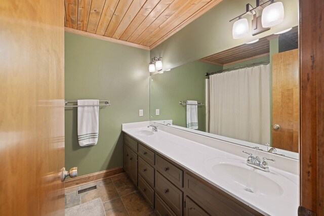 bathroom featuring wood ceiling, visible vents, ornamental molding, and a sink