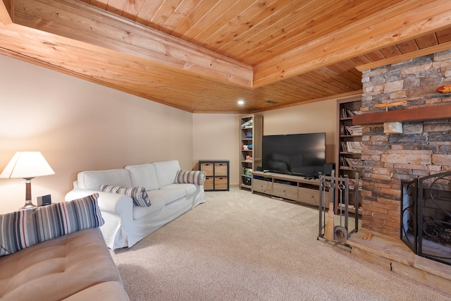 carpeted living area with wood ceiling