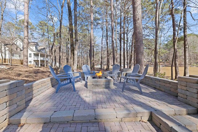 view of patio / terrace featuring a fire pit