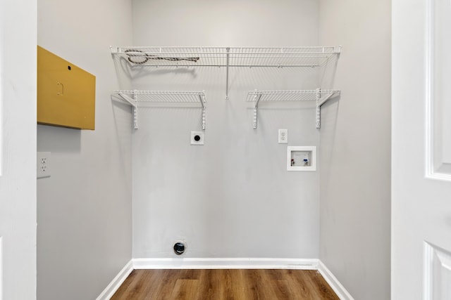 laundry area with electric dryer hookup, baseboards, hookup for a washing machine, and laundry area