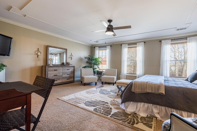 carpeted bedroom featuring ornamental molding and ceiling fan