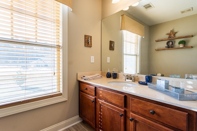 bathroom with vanity and wood-type flooring