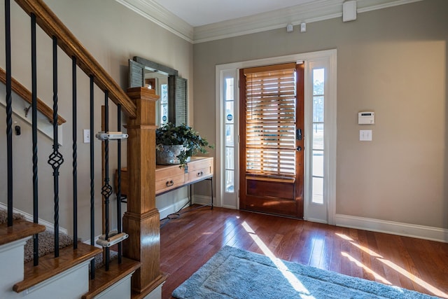 entrance foyer with crown molding and dark wood-type flooring