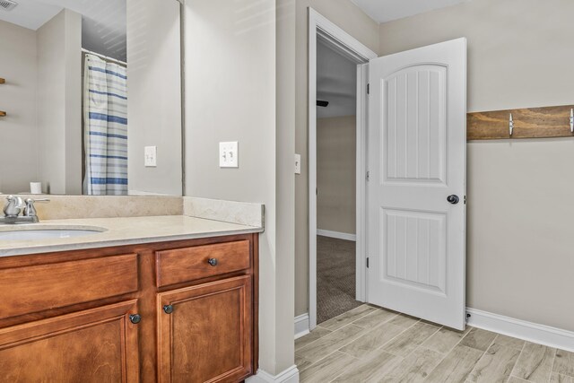 dining space with built in shelves, ornamental molding, and dark hardwood / wood-style flooring