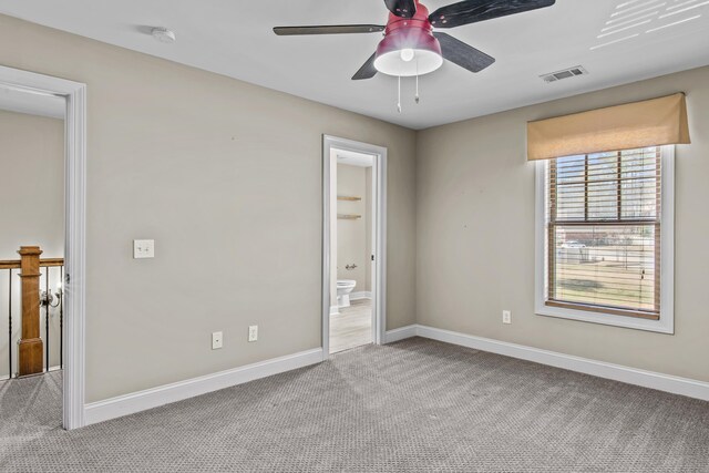 living area with crown molding, hardwood / wood-style floors, built in features, and a fireplace