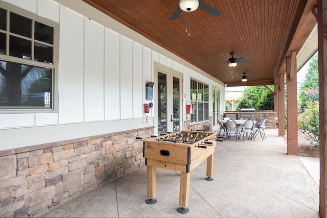 view of patio / terrace featuring ceiling fan, area for grilling, and a grill