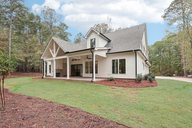 1280 Lake Dr, Greensboro, GA 30642 - rear view of house with a shingled roof, a ceiling fan, and a lawn