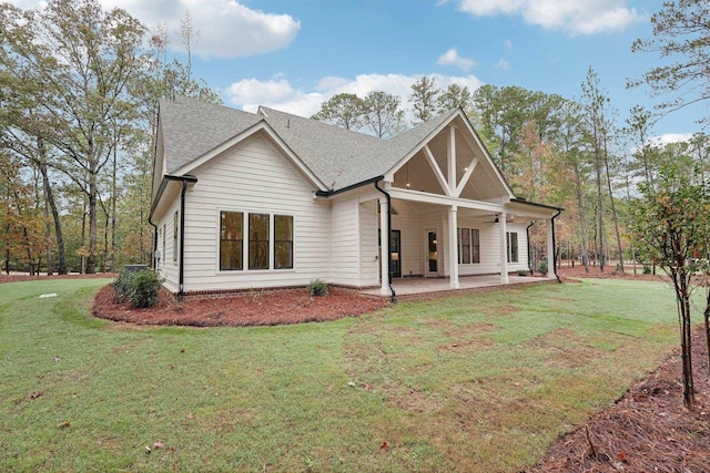 1280 Lake Dr, Greensboro, GA 30642 - rear view of property with a yard and a shingled roof