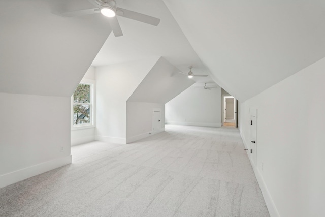 1280 Lake Dr, Greensboro, GA 30642 - additional living space with light carpet, baseboards, lofted ceiling, and ceiling fan